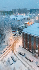 Winter snowy evening. Upper view on Grebnevskaya church and apartment buildings in Odintsovo, Russia.