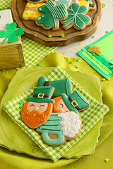 Composition with tasty gingerbread cookies for St. Patrick's Day celebration on table