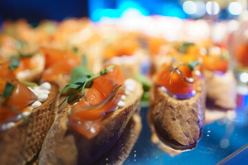 Sandwiches with red fish. salmon canape on buffet table