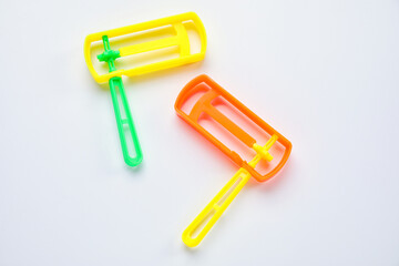 Jewish rattles for Purim holiday on white background