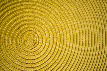 Fototapeta na wymiar Close up of a yellow piece of cloth textured background with circles 