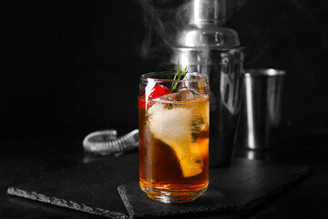 Glass of delicious Old Fashioned Cocktail on black background