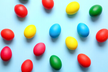 Multicolored Easter eggs on color background