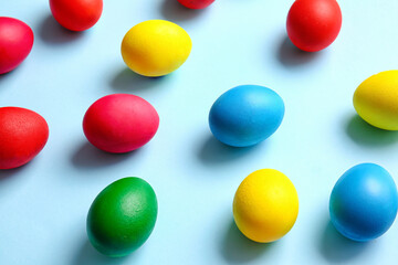 Multicolored Easter eggs on color background