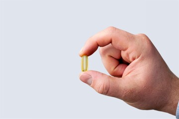 Hand of a doctor holding antiviral drug against coronavirus covid 19 outbreak
