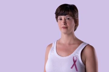 Fototapeta na wymiar Woman with pink ribbon fighting against cancer.