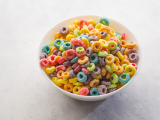 Crispy cereal flakes, snacks in a bowl on a white background. Quick breakfasts. Fruit, milk, orchids, honey. Traditional American breakfast. There are no people in the photo.