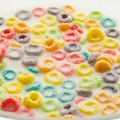 On a white background, a lot of cereal crispy multi-colored snacks. Quick breakfasts, sweet fruit food, ready to eat. Beautiful composition. Supermarket, advertising, banner.