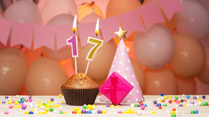 Decorations with balloons and a happy birthday candle with the number 17 for a child. Happy...