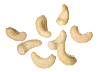 Tasty raw cashew nuts falling on white background