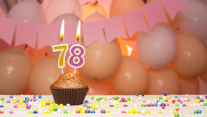 Decorations with balloons and a happy birthday candle with the number 78 for a woman. Happy...