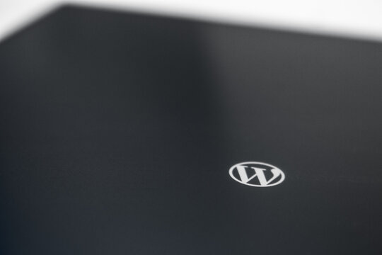 Kumamoto, JAPAN - Oct 30 2019 :
Closeup WordPress logo on tablet in monochrome. WP is using content management system (CMS) based on PHP, MySQL. It is used by over 60 million websites around the world