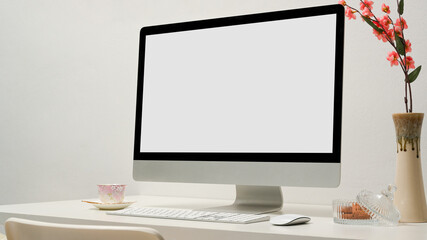 Close-up image, Modern office desk with pc desktop computer in white office room.