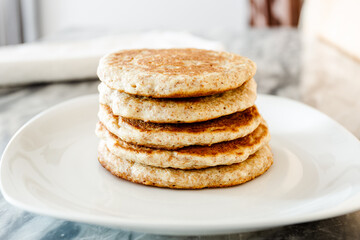 Simple pancakes on a white plate. Vegan recipe for breakfast