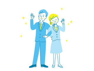 腕を組んでOKサインする男女のカップル