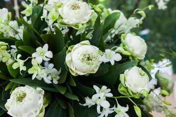 Floral arrangement at a wedding ceremony on beach.