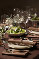 Stylish elegant table setting for festive dinner in restaurant