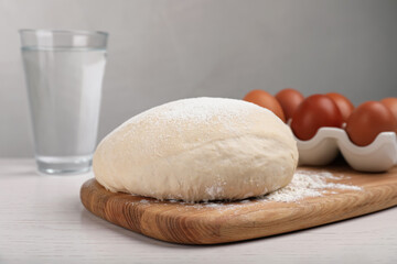 Fototapeta na wymiar Fresh dough on white wooden table. Sodawater bread recipe