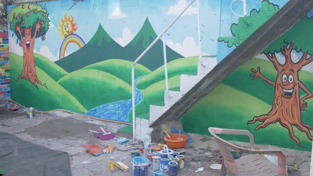 Wide shot vibrant nature scenic mural in kids playground