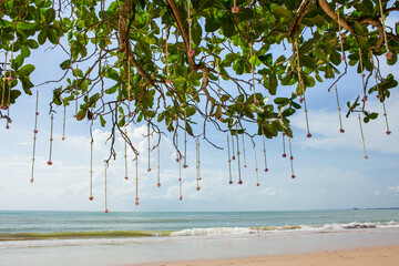 Floral arrangement at a wedding ceremony on beach.