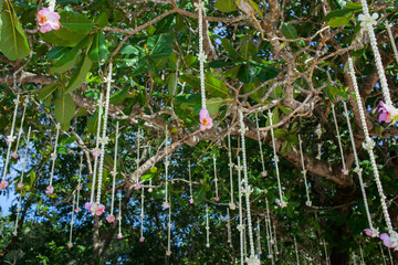Floral arrangement at a wedding ceremony on beach.