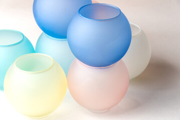 Modern futuristic still life with various coloured spheres in pastel tones.