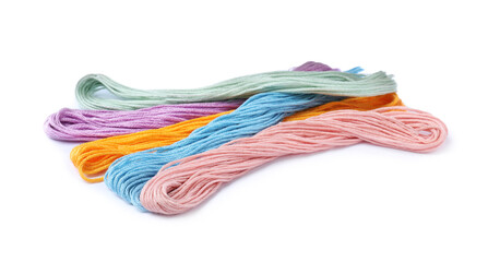 Set of colorful embroidery threads on white background