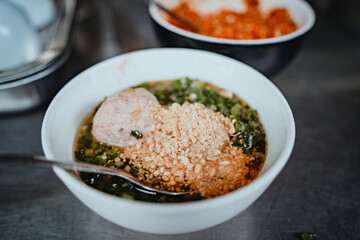 Sizzling Vietnamese mini egg - Vietnamese cuisine, Banh Can. Vendor hawker making Banh Can