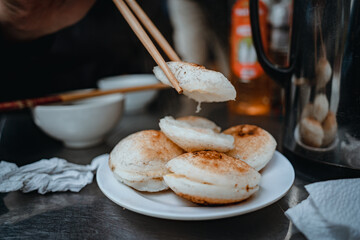 Sizzling Vietnamese mini egg - Vietnamese cuisine, Banh Can. Vendor hawker making Banh Can