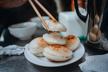 Sizzling Vietnamese mini egg - Vietnamese cuisine, Banh Can. Vendor hawker making Banh Can