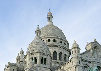 Fototapeta na wymiar The Basilica of the Sacred Heart of Paris, commonly known as Sacre-Coeur Basilica, located in the Montmartre district of Paris, France
