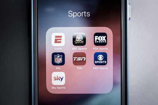 Kumamoto, Japan - Aug 17 2020 : The logos of popular sports media / apps in monochrome. ESPN & competitors / alternatives (NBC, FOX, NFL, TSN, CBS and Sky) icons on iPhone.