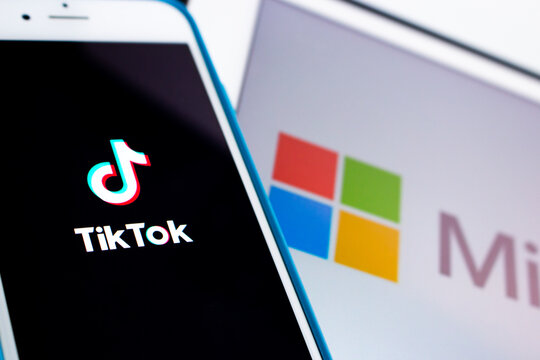 Kumamoto, Japan - Aug 3 2020 :.Concept image of TikTok & Microsoft logos on iPhone / iPad. In Aug 2020, President Trump gives Microsoft 45 days to buy TikTok from China's Bytedance