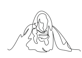 a cold person is drinking soup under a duvet and blanket