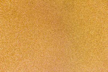 Fototapeta premium Full frame macro abstract texture background of a frosted glass window pane with natural ice crystals colorized in a golden hue