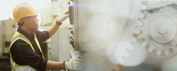 Professional work man engineer worker operate maintenance machine in industry factory wide space...