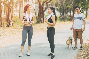 Lady wife girl gossip with friend while morning jogging. Husband man look suspiciously and puzzled.