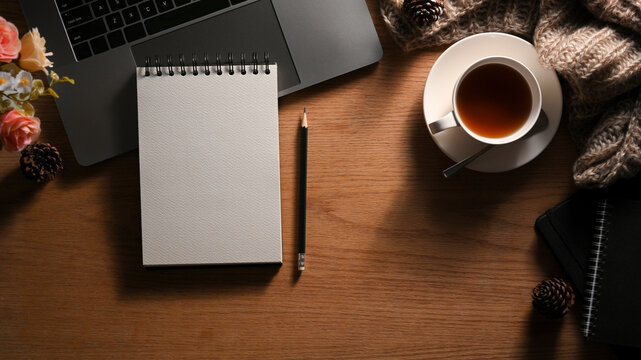 Empty spiral notepad page with cozy vintage workspace compositions