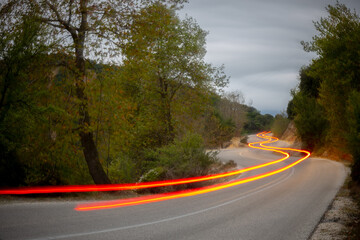 Taillight Trails on the Evening Forest Road