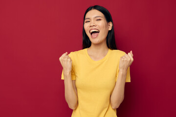 woman gestures with his hands in a yellow t-shirt casual wear Lifestyle unaltered