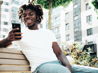 Handsome hipster model.Unshaven African man dressed in white summer t-shirt.Fashion male with...