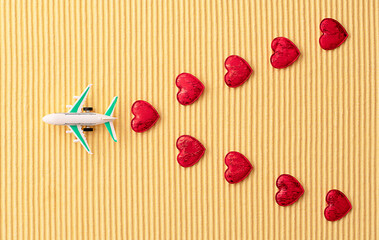 airplane model on yellow background, travel concept