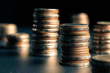 Pile of gold coins stack in finance treasury deposit bank account for saving . Concept of corporate...