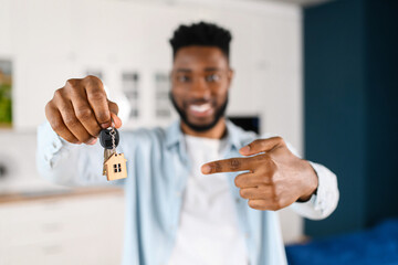 Relocation concept. Headshot of excited male moving in new home or apartment. Cheerful multiracial...