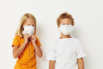 Cute stylish kids in medical mask protection posing grimace lifestyle unaltered