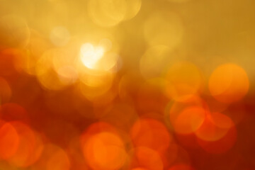 Fototapeta premium Gold bokeh texture. Festive glitter background with defocused lights