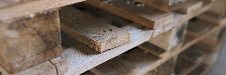 Construction wooden pallets are stacked together closeup