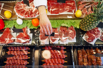 Fresh raw good quality meat on counter in Butcher shop