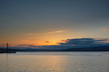 Dawn in the morning over the sea. Seascape with the rising Sun over the Bosphorus. Istanbul, Turkey.