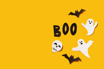 Halloween set decorations with ghost, bat, skeleton and word BOO on yellow background. Holiday...
